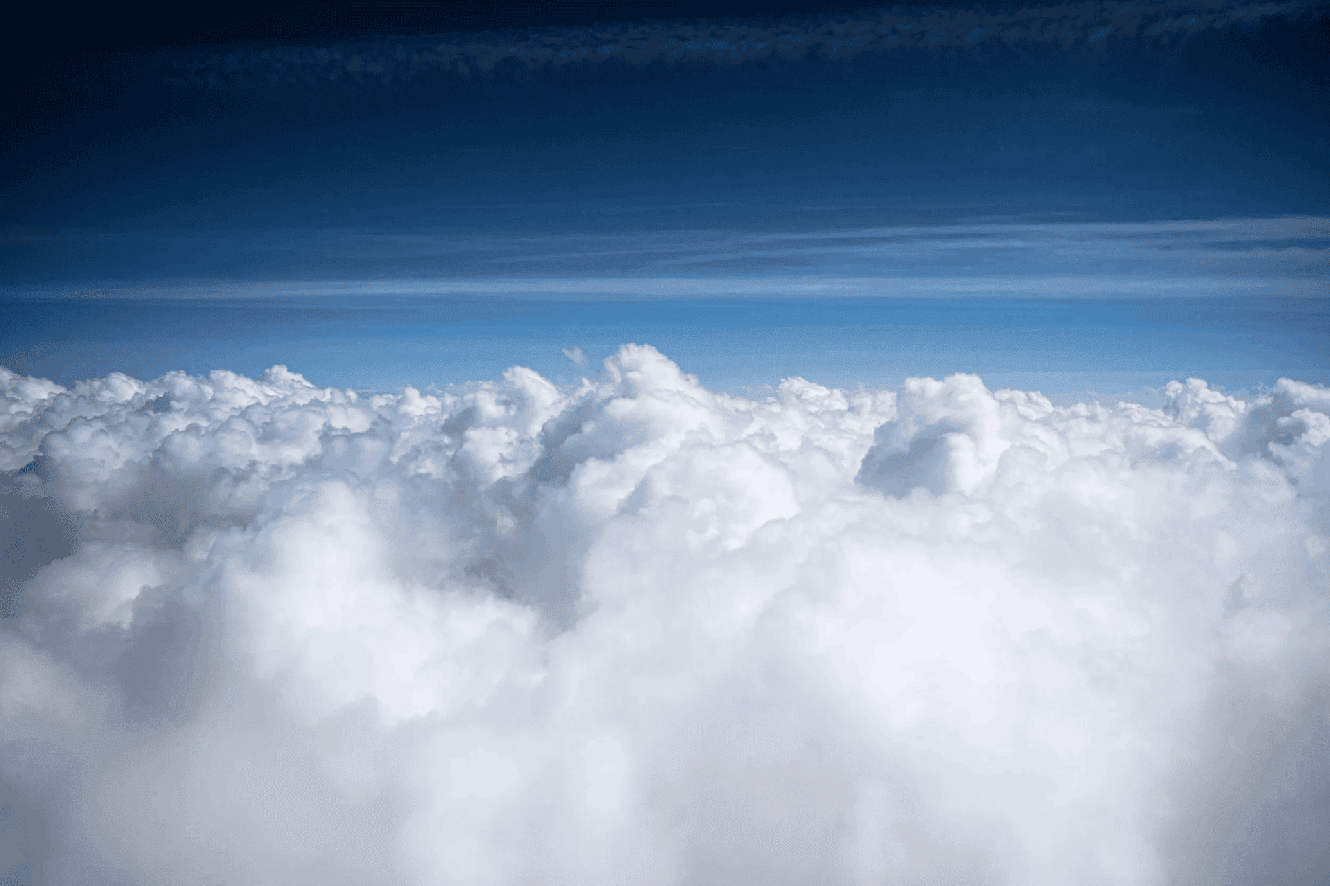 A photo of a blue sky covered with clouds that shows how nature-friendly regenerative tourism is.
