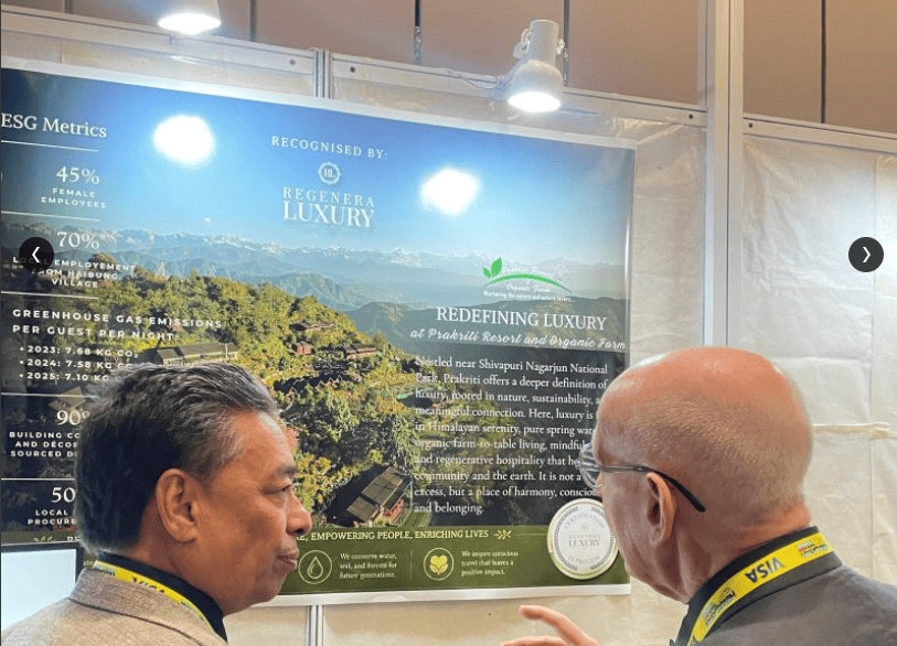 Visitors reading the Regenera Luxury collaboration banner at the Prakriti stand, PATA Himalayan Travel Mart 2026