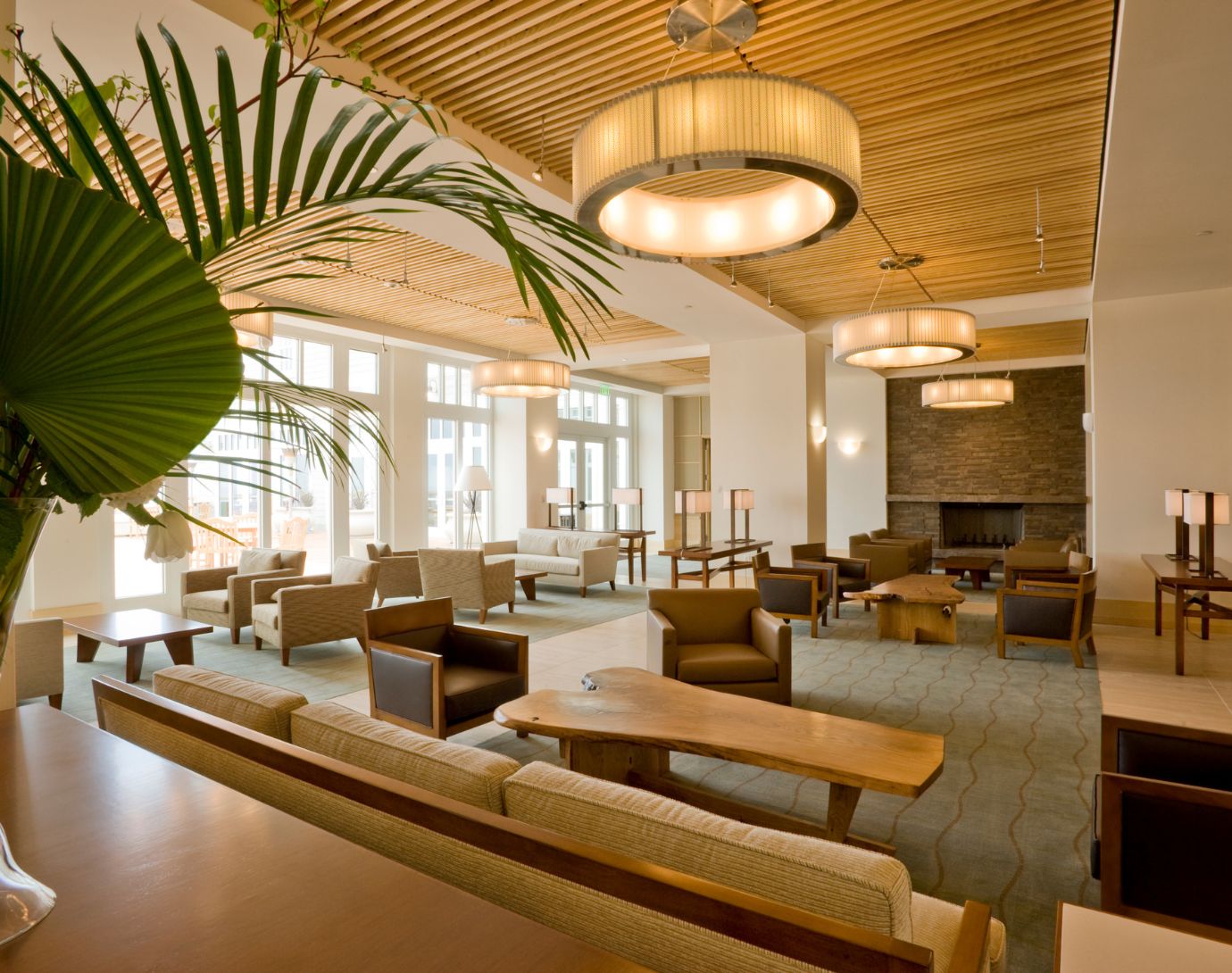 A visually stunning luxury hotel surrounded by lush greenery, reflecting harmony with nature. The image highlights eco-friendly architectural design and a serene environment, symbolizing REGENERA LUXURY Association's commitment to promoting regenerative practices in the hospitality and tourism industry.